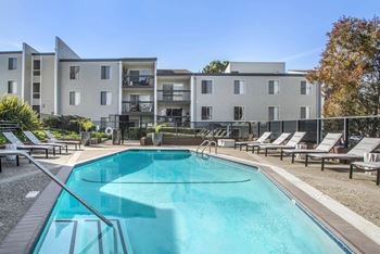 Our apartments have a resort style pool with lounge chairs 